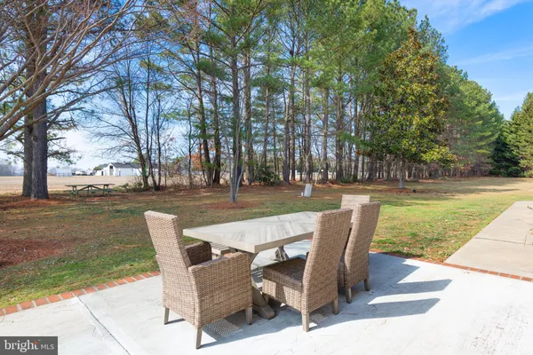 a view of a house with backyard outdoor space and garden