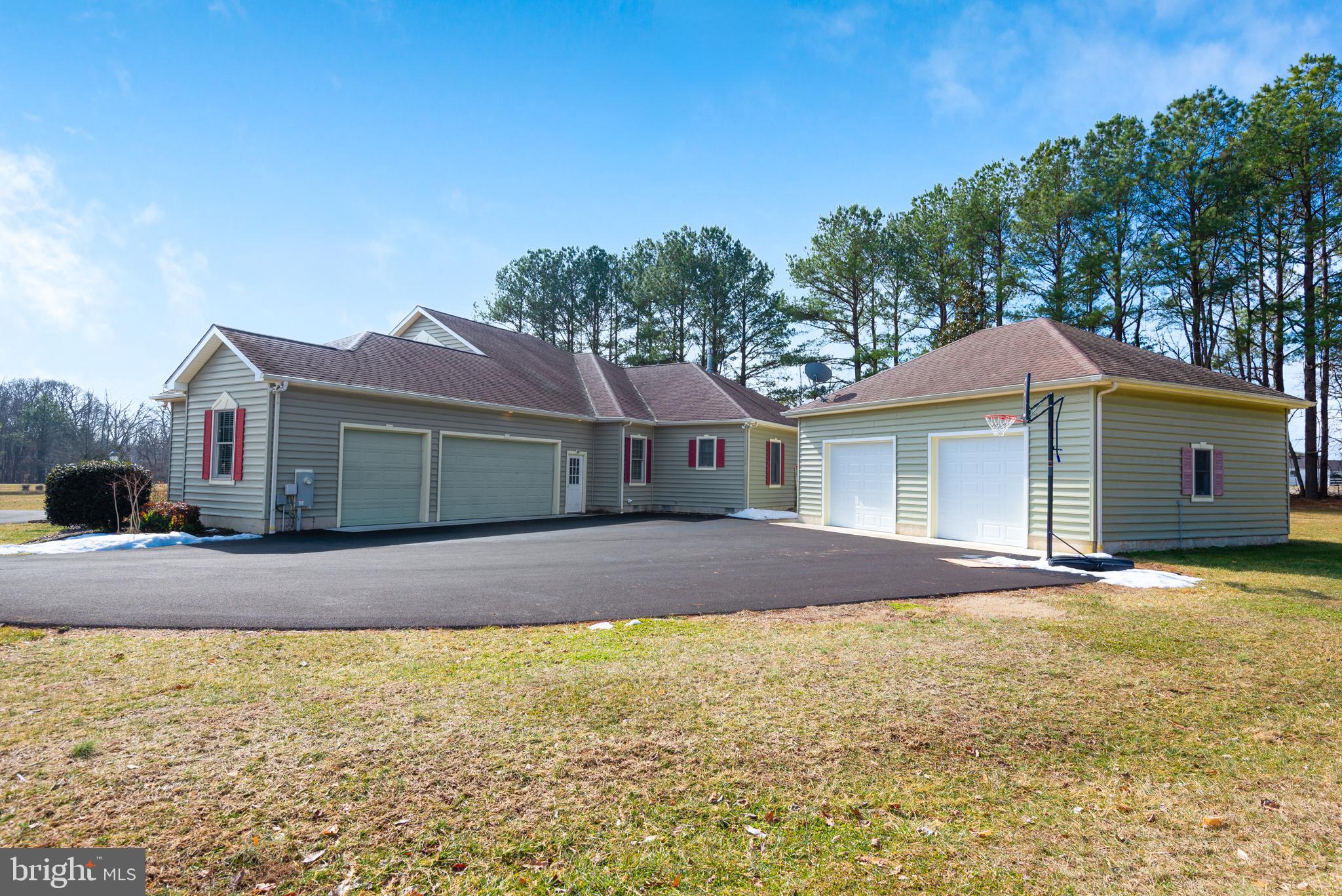 28715 Jacks Field Road Wye Mills, MD 21679 - Photo 6 of 27 a front view of a house with a yard and garage
