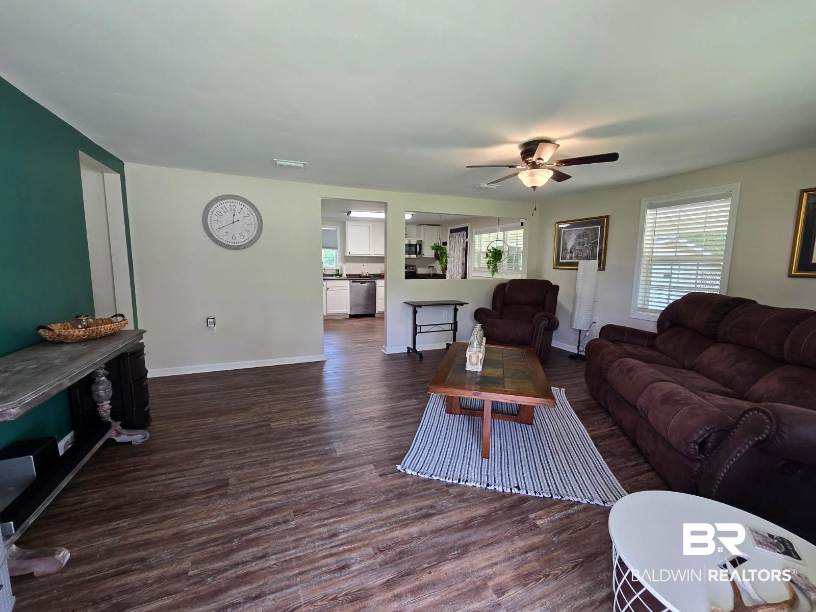 2534 Foshee Road Brewton, AL 36426 - Photo 13 of 16 Living area featuring baseboards, dark wood-type flooring, and ceiling fan