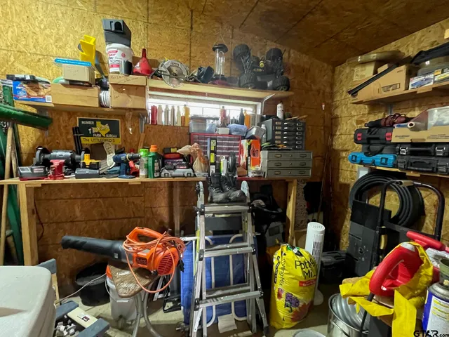 a view of a living room and floor to ceiling window