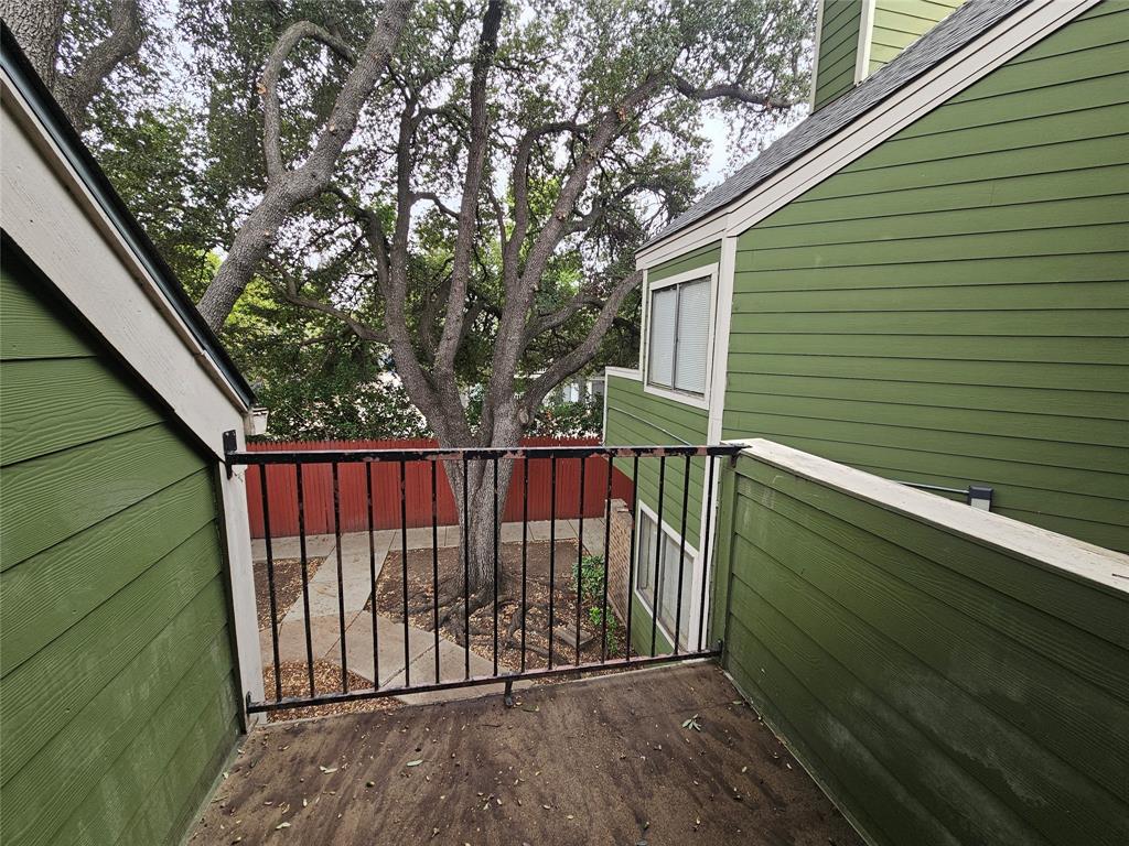 9823 Walnut Street, Unit 208 Dallas, TX 75243 - Photo 15 of 16 a view of backyard with a deck and wooden floor