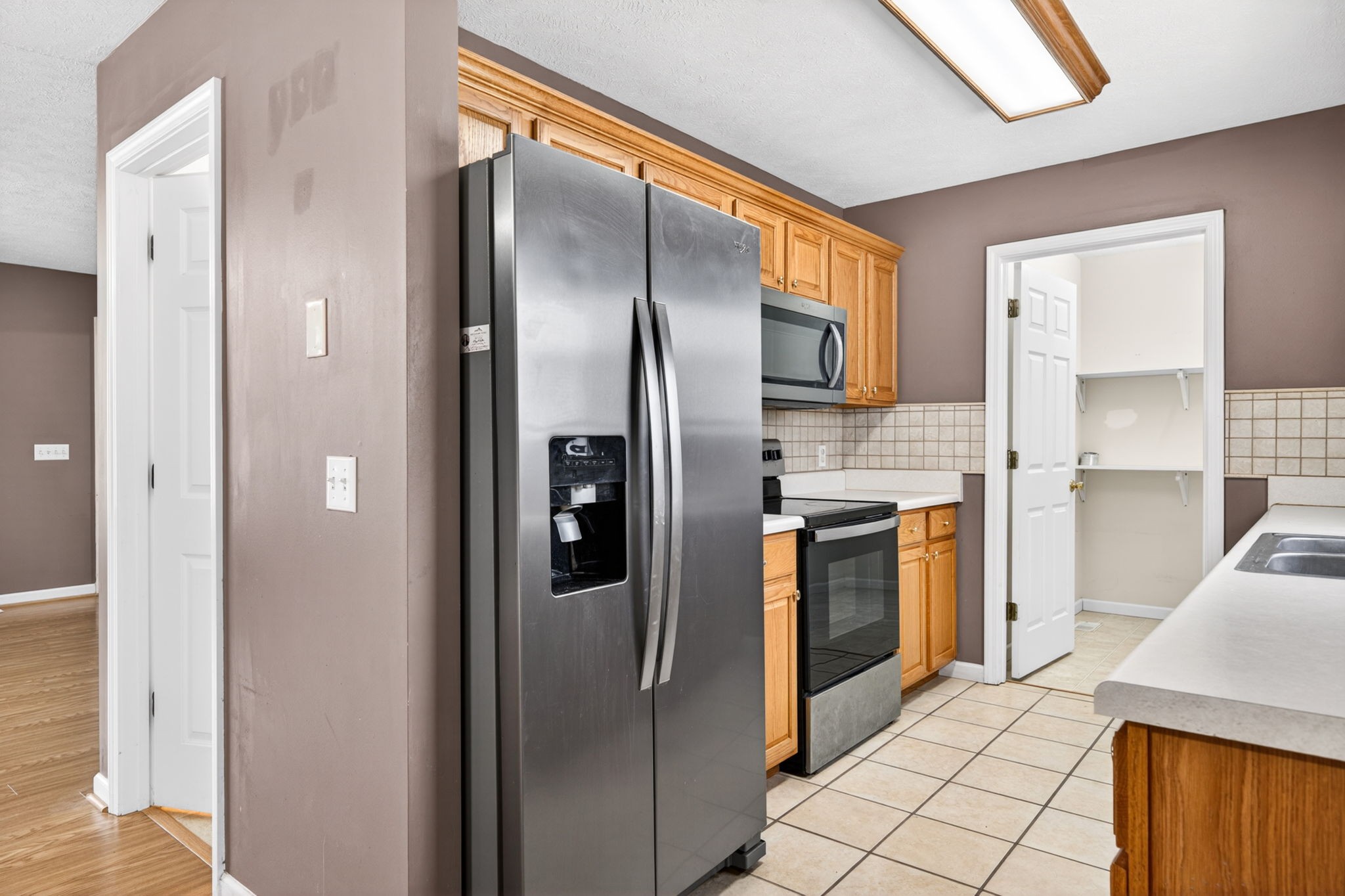 291 Poplar Point Lane Rickman, TN 38580 - Photo 4 of 41 a kitchen with stainless steel appliances granite countertop a refrigerator and a sink