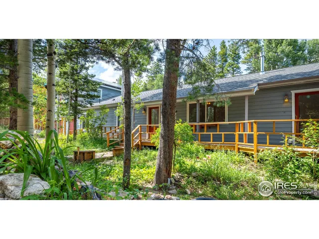 a view of a house with a flower garden
