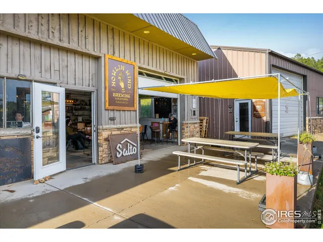 a view of a building with sitting area