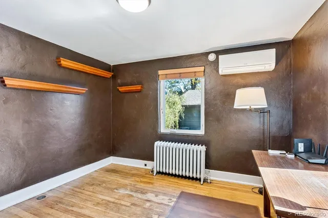 a view of a livingroom with a chair and a porch