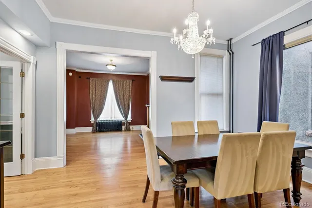 a view of a dining room with furniture and window
