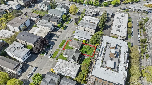 an aerial view of residential house with outdoor space