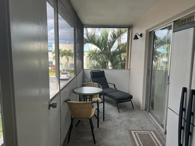 a view of a livingroom with furniture and window