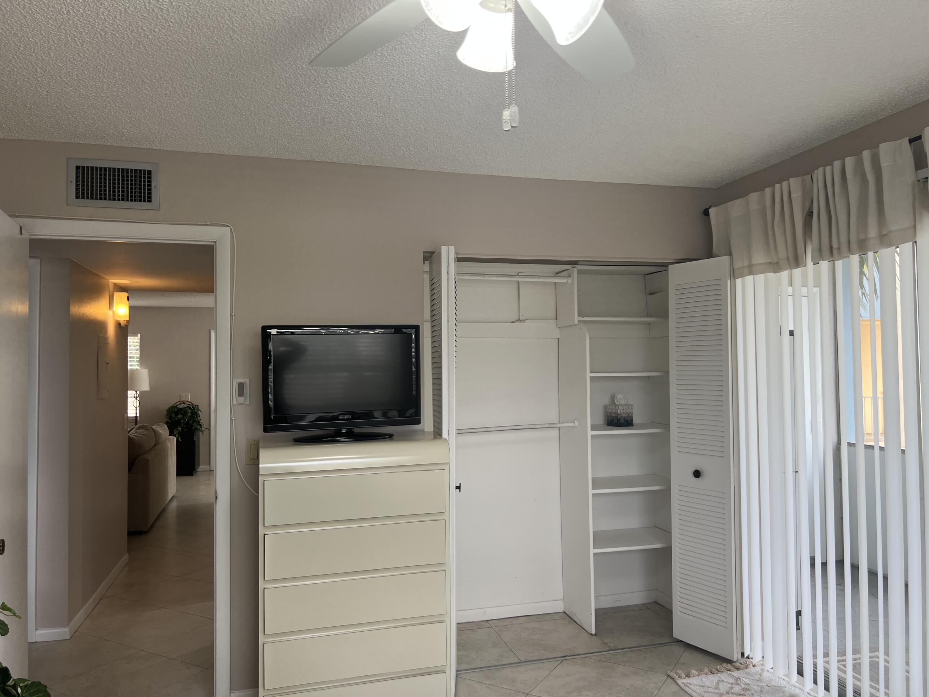 900 Flanders South Delray Beach, FL 33484 - Photo 18 of 52 a view of a livingroom with a flat screen tv