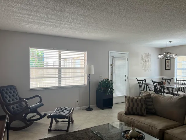 a kitchen with a refrigerator and a sink