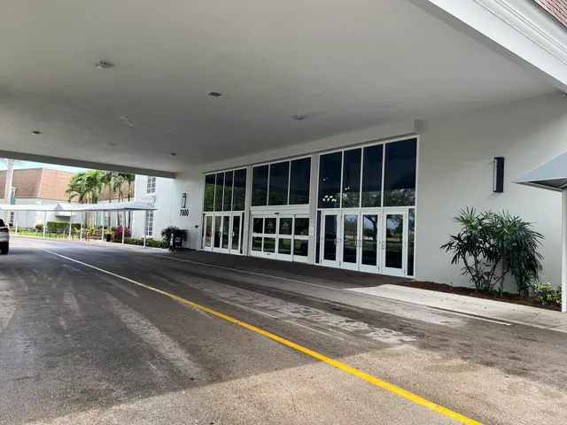 a kitchen with a table and chairs in it
