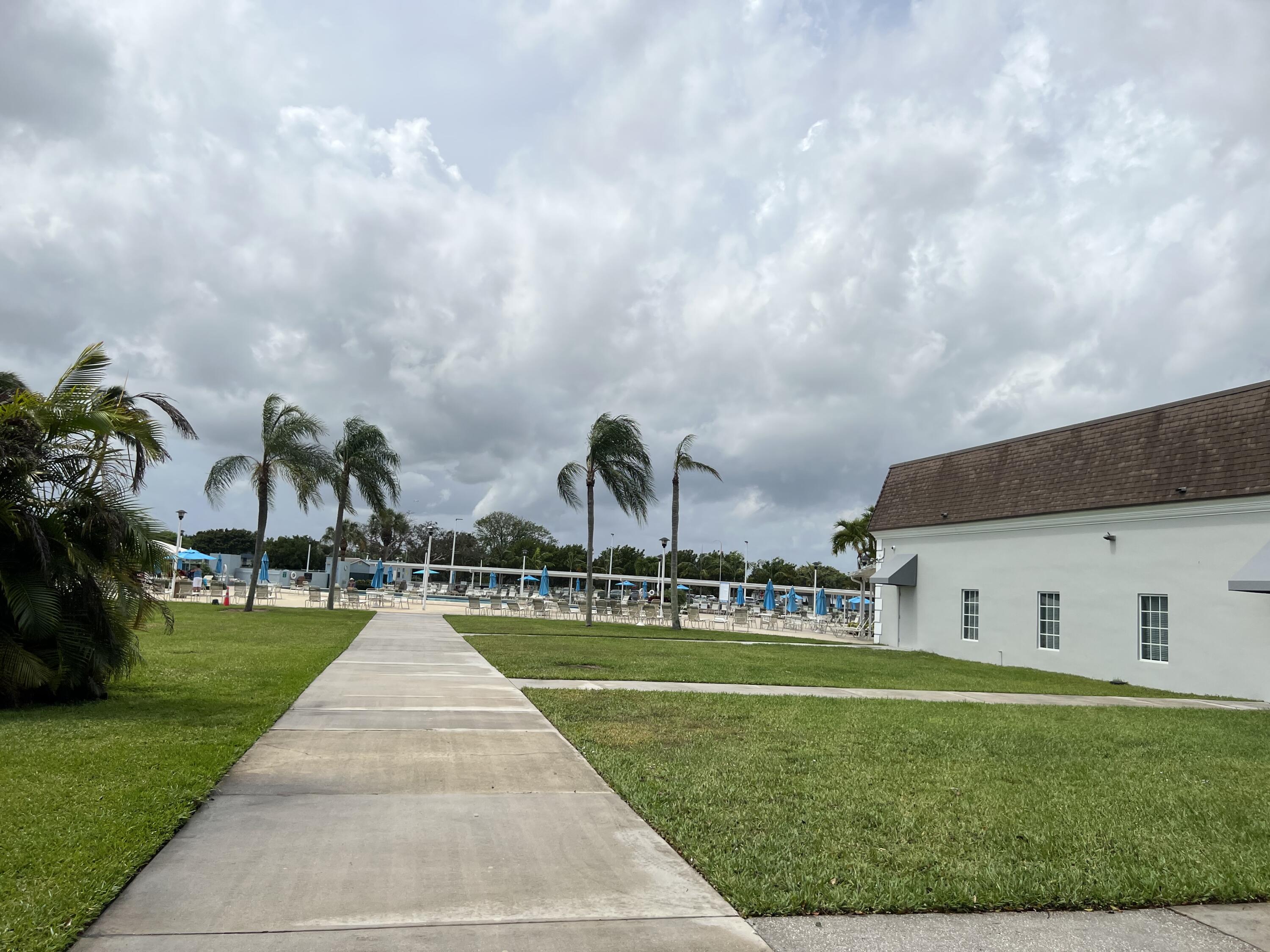 900 Flanders South Delray Beach, FL 33484 - Photo 49 of 52 a front view of a house with garden