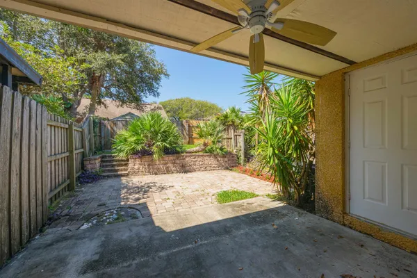 a view of yard with wooden fence