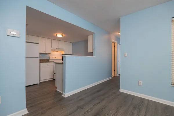 a view of a kitchen with wooden floor