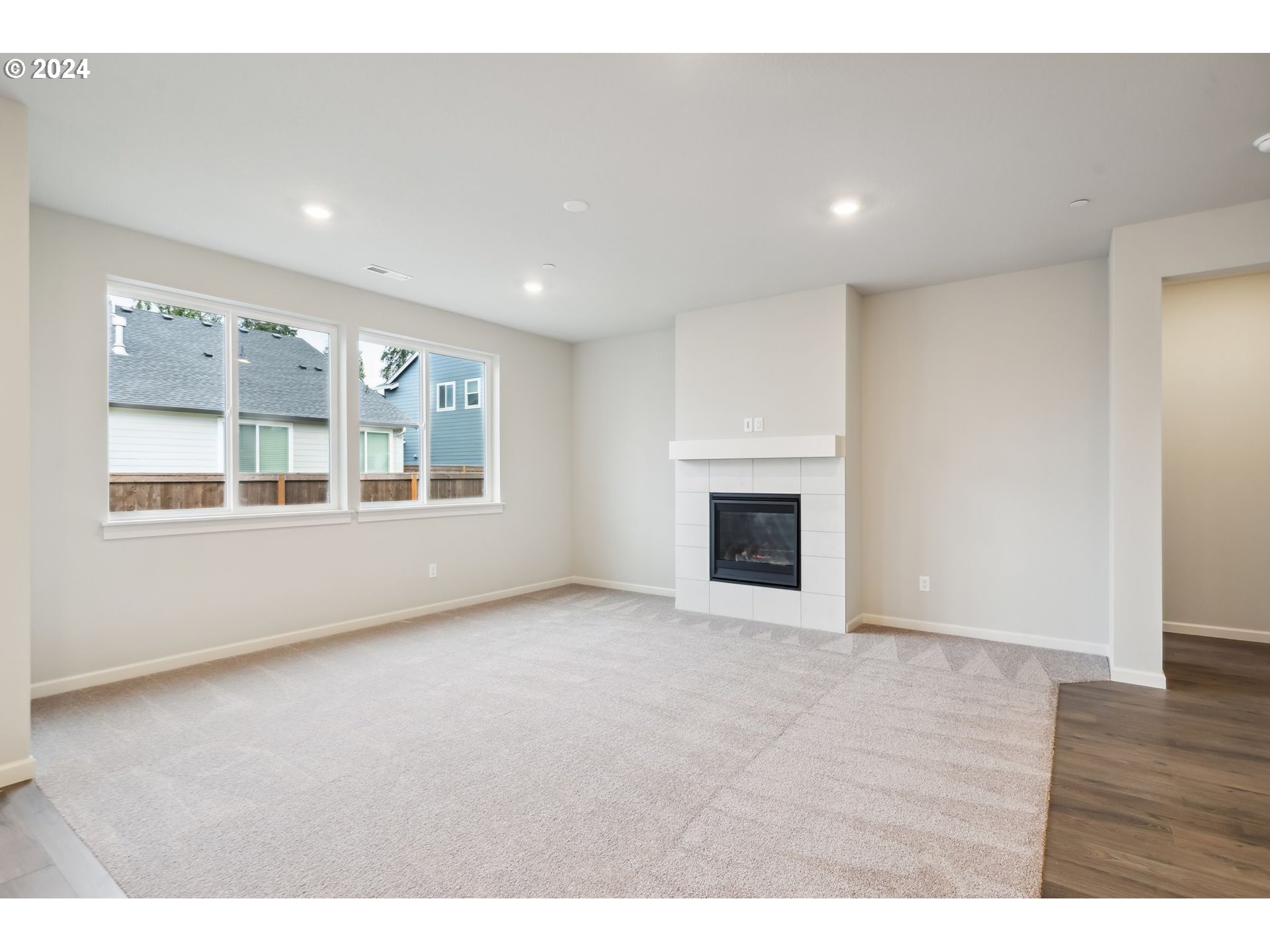 2706 South 7th Circle Ridgefield, WA 98642 - Photo 17 of 26 a view of an empty room with a window and fireplace