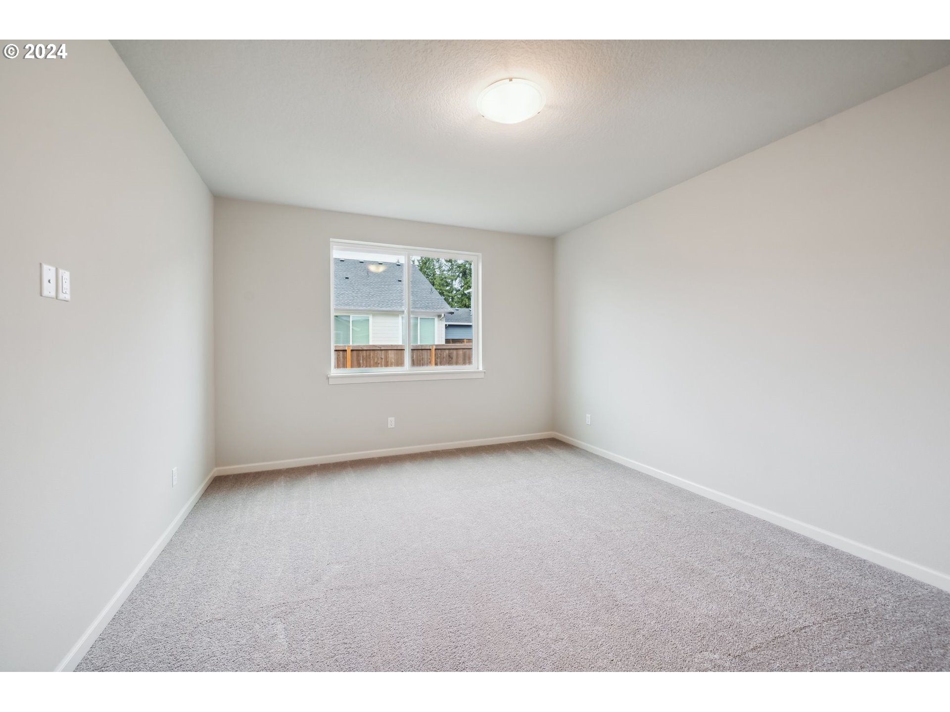 2706 South 7th Circle Ridgefield, WA 98642 - Photo 18 of 26 a view of an empty room with a window