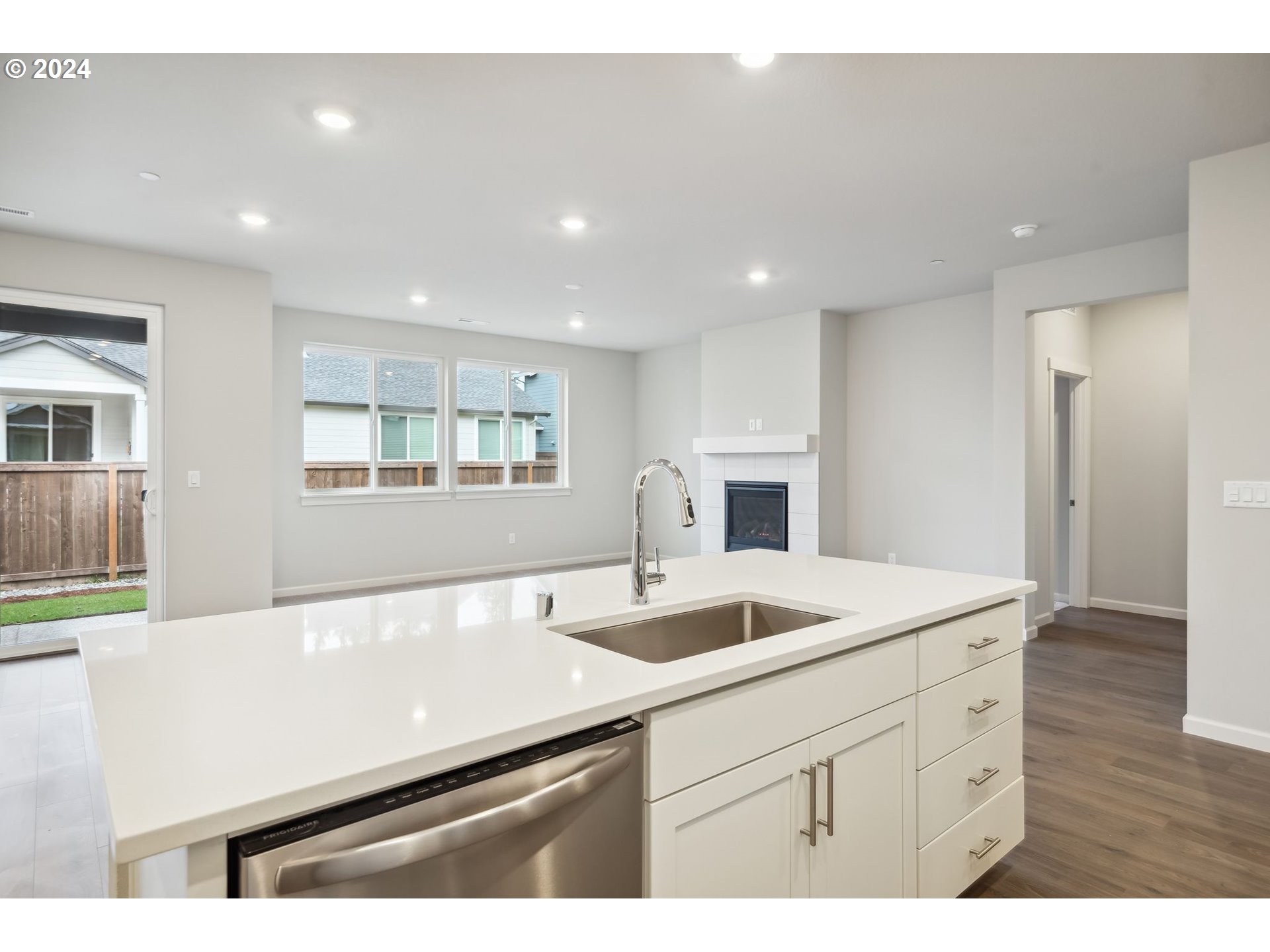 2706 South 7th Circle Ridgefield, WA 98642 - Photo 4 of 26 a kitchen with a sink appliances and cabinets