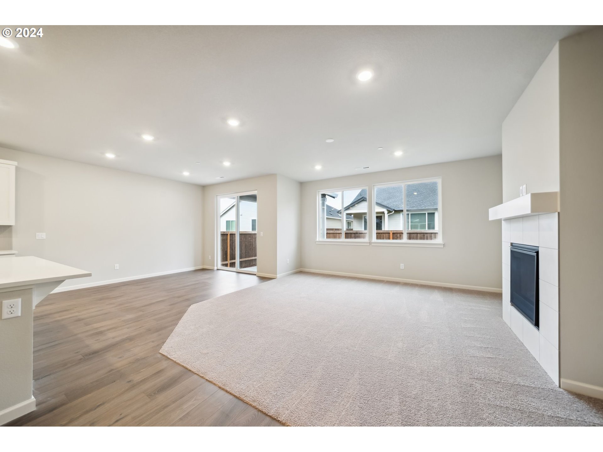 2706 South 7th Circle Ridgefield, WA 98642 - Photo 5 of 26 a view of an empty room with a window and fireplace