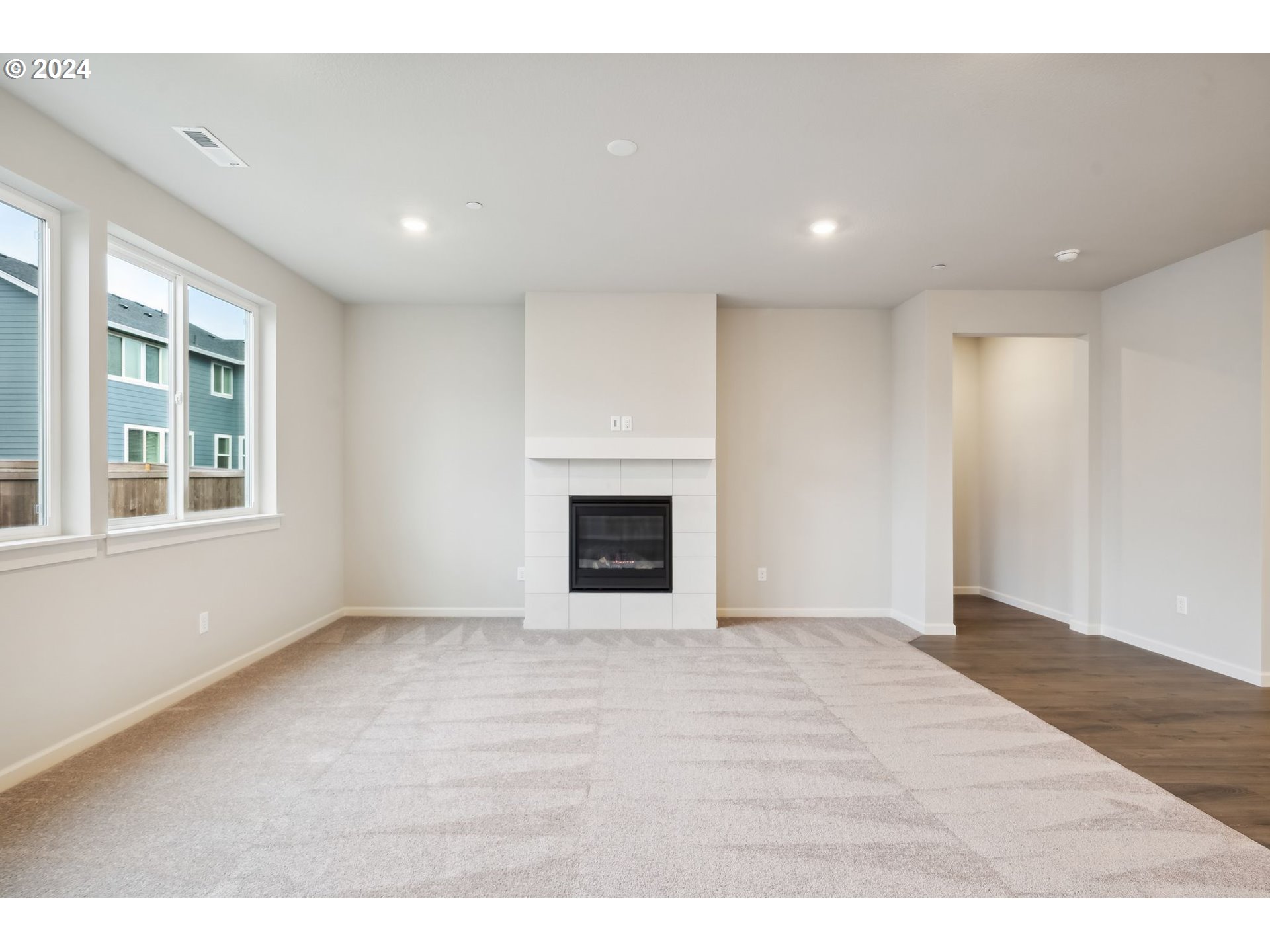 2706 South 7th Circle Ridgefield, WA 98642 - Photo 6 of 26 a view of an empty room with a window and fireplace
