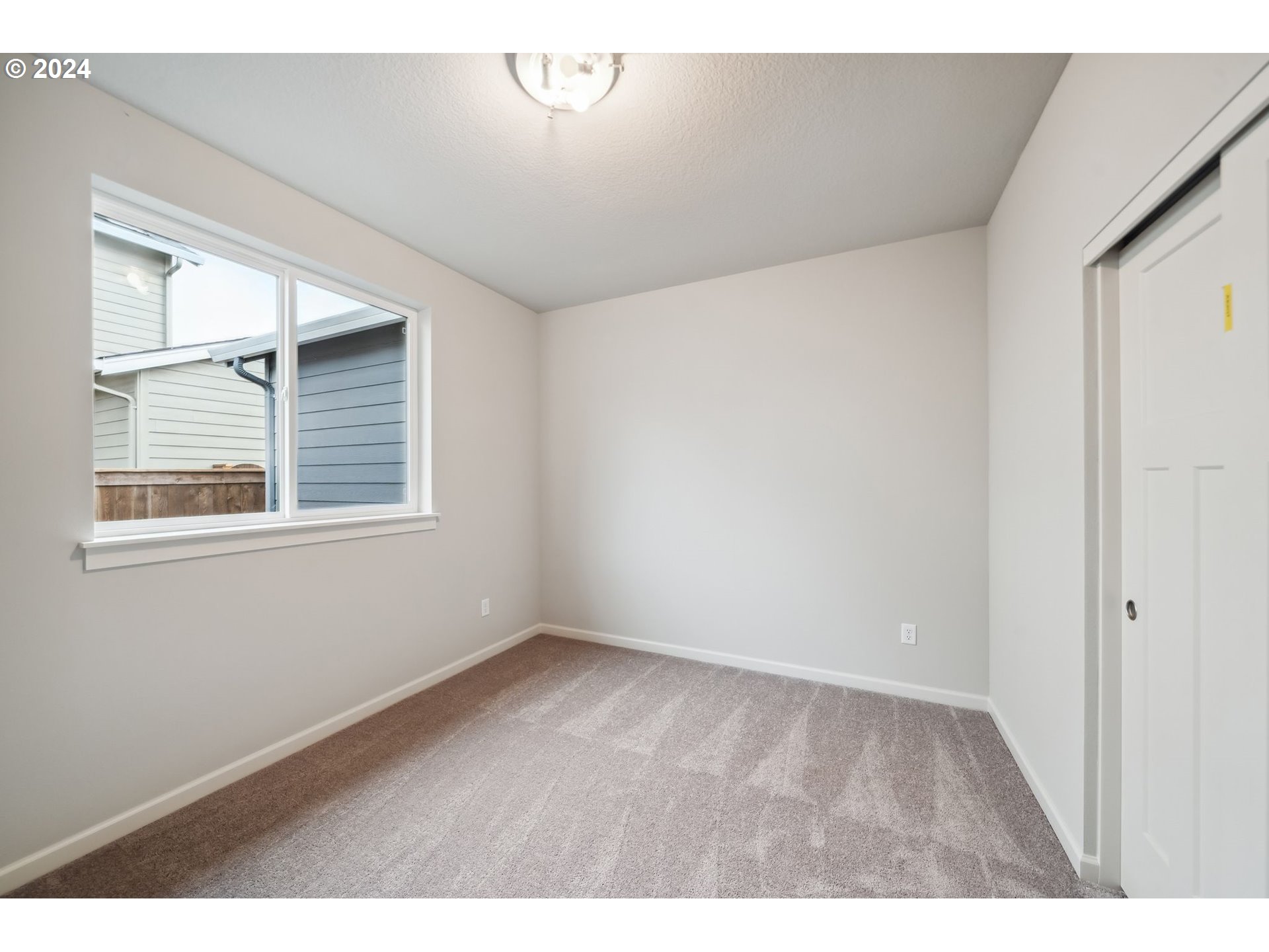 2706 South 7th Circle Ridgefield, WA 98642 - Photo 7 of 26 a view of an empty room with a window