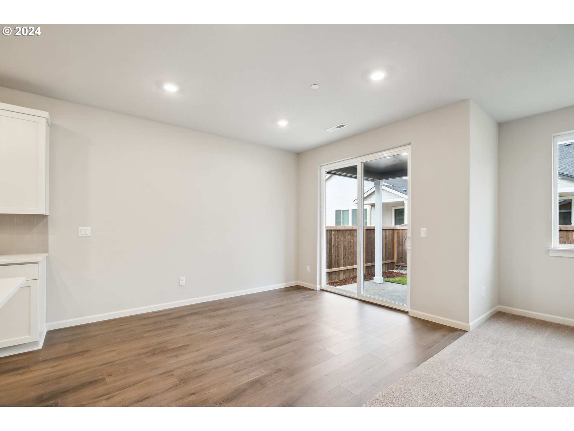 2706 South 7th Circle Ridgefield, WA 98642 - Photo 9 of 26 a view of an empty room with wooden floor