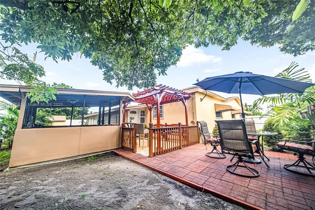 an outdoor space with furniture and umbrella