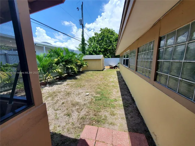 a view of a room with a large window