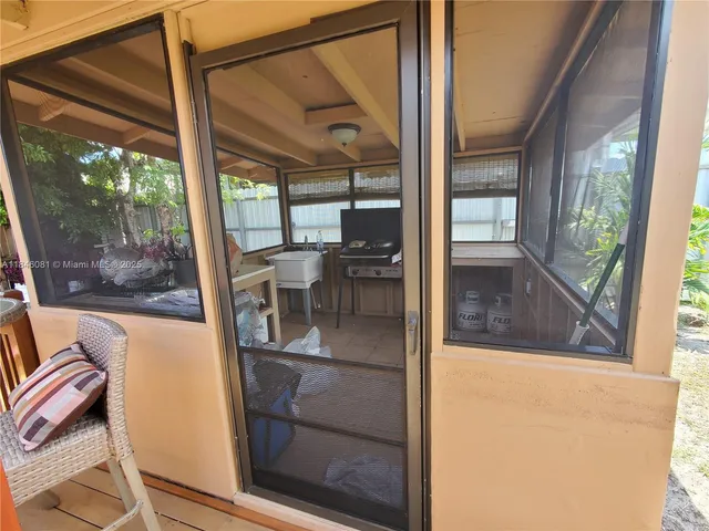 a bathroom with a granite countertop sink mirror vanity and toilet