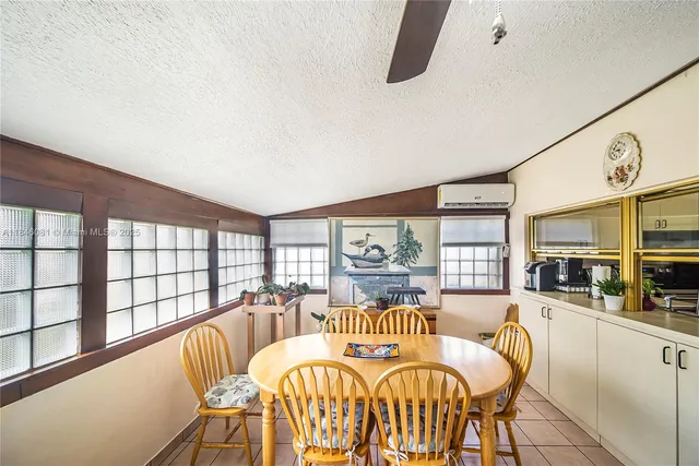 a living room with furniture a rug and a table