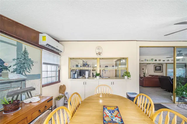a dining room with furniture and chandelier