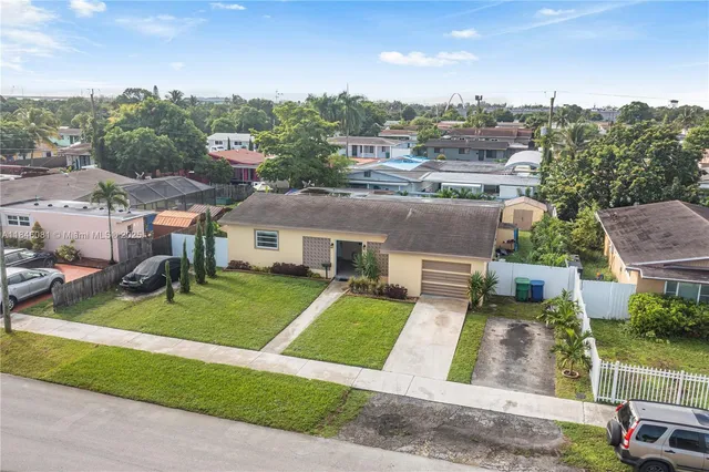 an aerial view of a house with a lake view