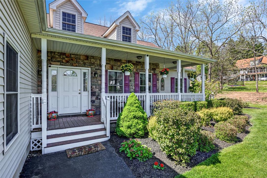 112 Michaels Run Road Stroudsburg, PA 18360 - Photo 6 of 69 The covered front porch overlooks the beautiful landscaping and adds over 160sf of outdoor living space.