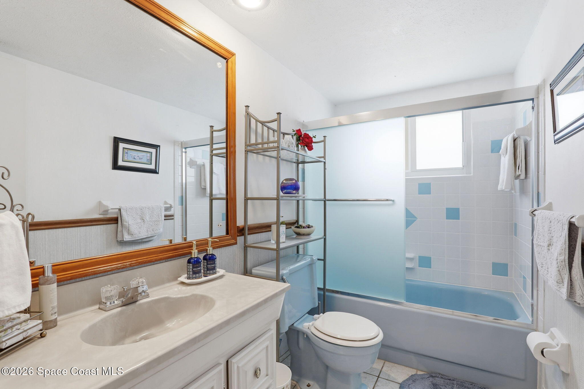 908 Jefferson Road Rockledge, FL 32955 - Photo 19 of 37 a bathroom with a sink toilet and shower