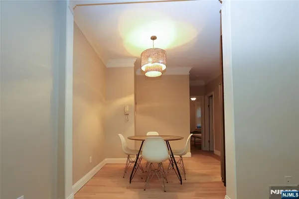 a view of a room with a table and chairs