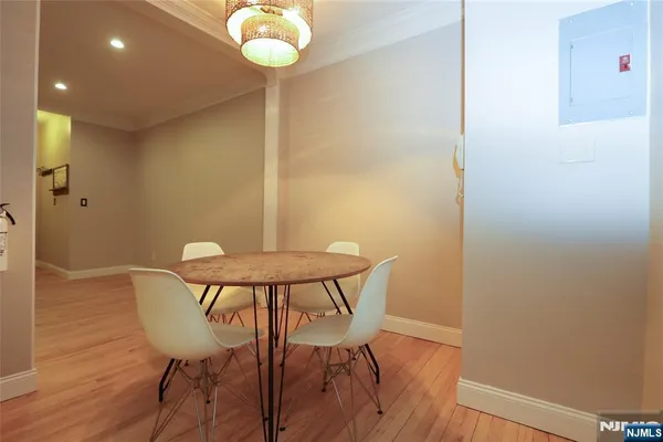 a view of a dining room with furniture and wooden floor