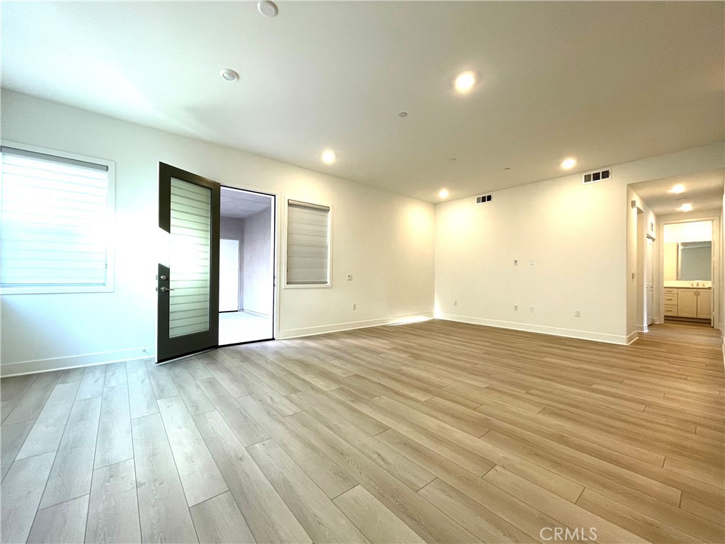 516 Neilson Irvine, CA 92618 - Photo 19 of 21 an empty room with wooden floor and windows