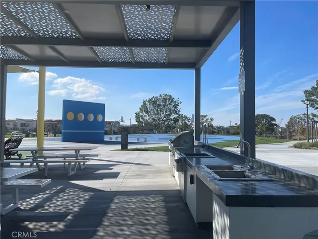 a kitchen with stainless steel appliances a refrigerator sink and microwave
