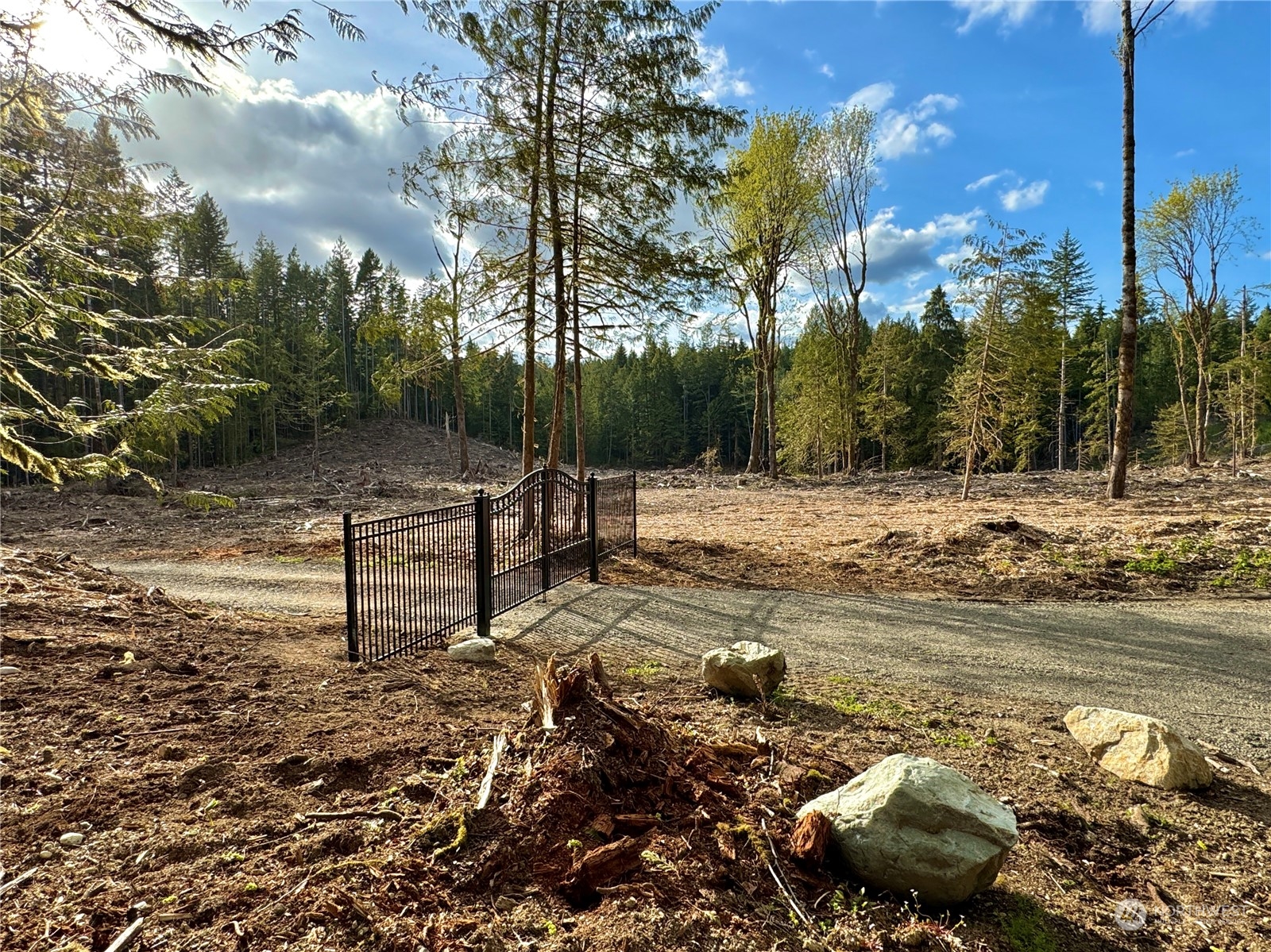 4300 Beauty Lake Road Southwest Port Orchard, WA 98367 - Photo 13 of 39 a view of a lake with a yard