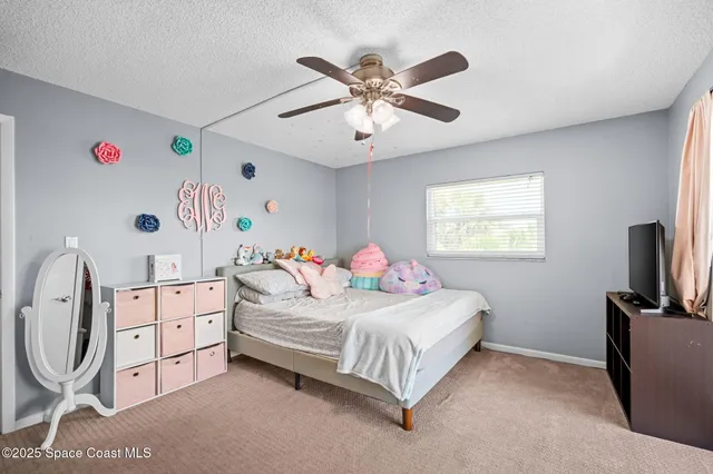 a view of a living room and floor to ceiling window or lake view