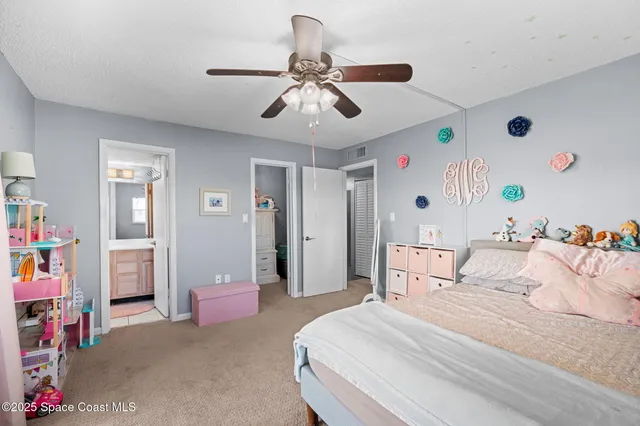 a bathroom with a toilet a sink a mirror and vanity