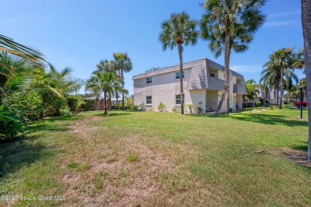 an aerial view of residential building and ocean