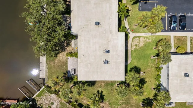 an aerial view of residential building and ocean