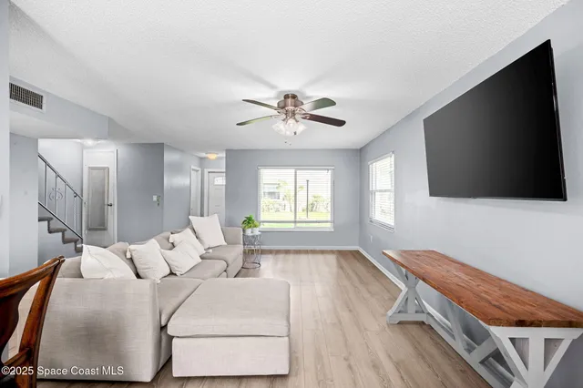 a kitchen with a sink a window stainless steel appliances and cabinets