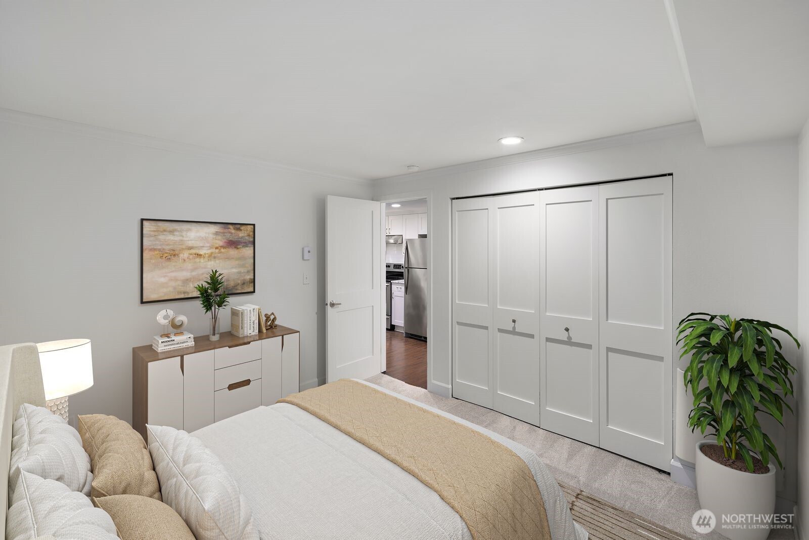 3901 Fremont Avenue North, Unit 202 Seattle, WA 98103 - Photo 17 of 23 a bedroom with a bed and a cabinets