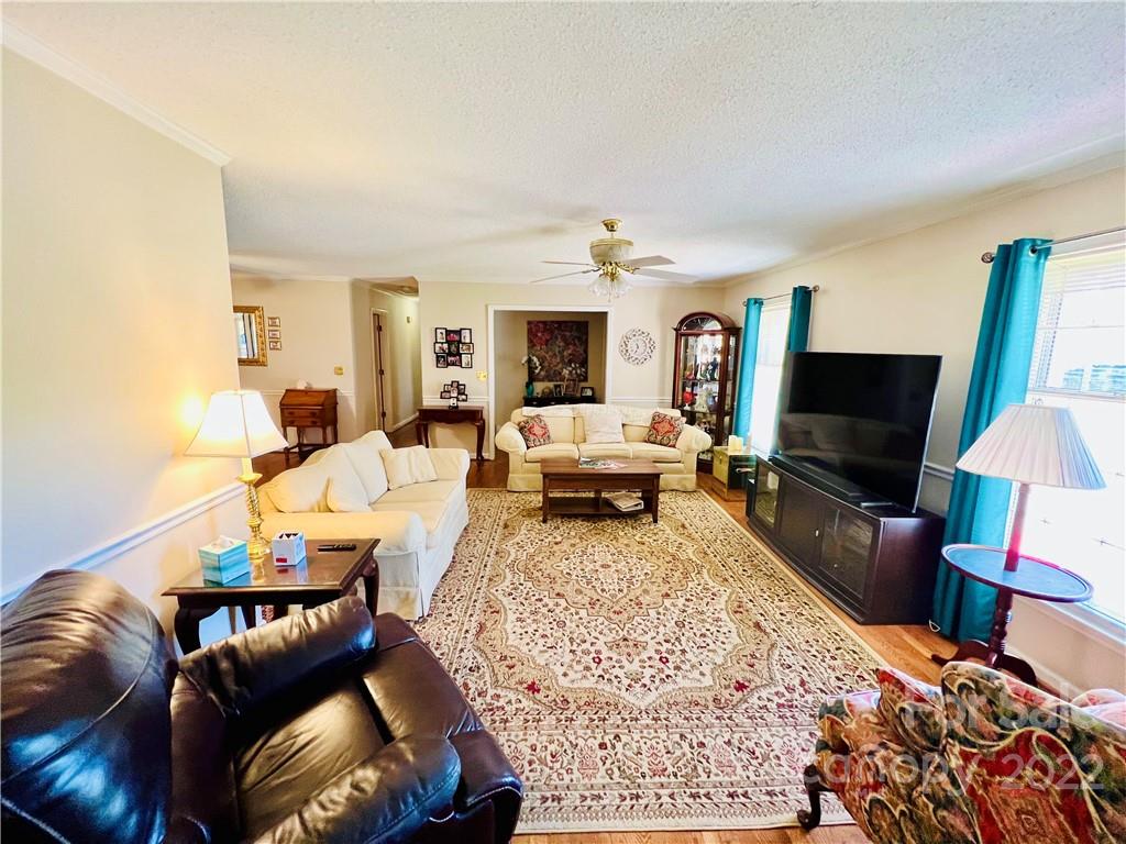 13701 Thompson Road Mint Hill, NC 28105 - Photo 12 of 25 a living room with furniture and a flat screen tv