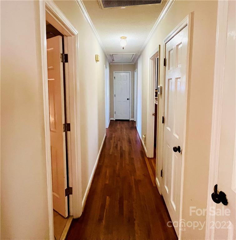13701 Thompson Road Mint Hill, NC 28105 - Photo 15 of 25 a view of a hallway with wooden floor and staircase