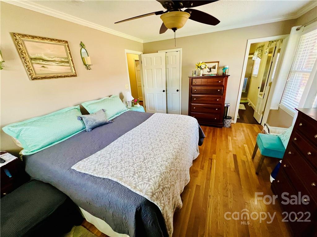 13701 Thompson Road Mint Hill, NC 28105 - Photo 21 of 25 a bedroom with a bed and a dresser