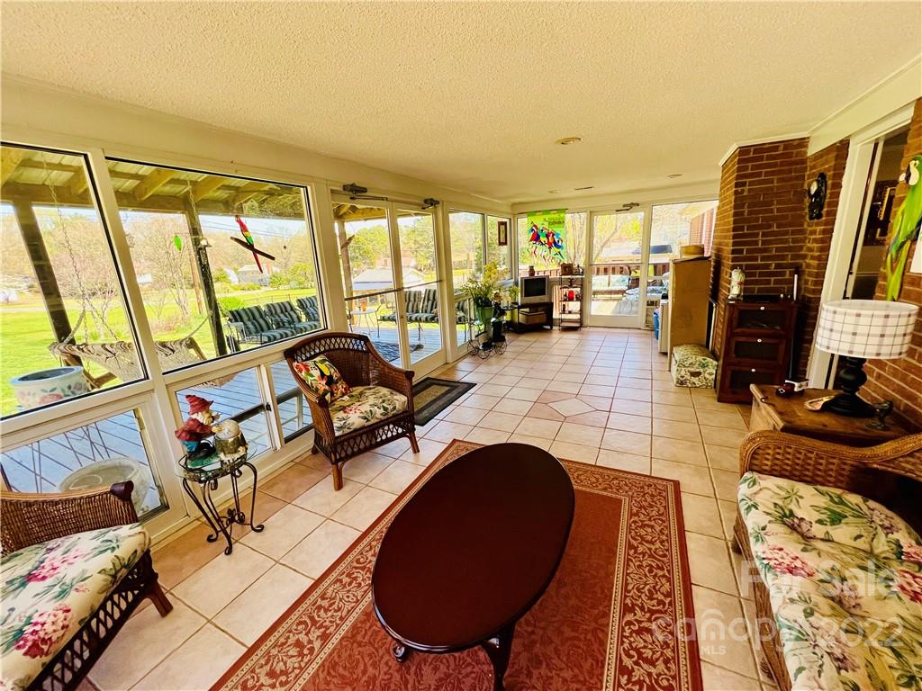 13701 Thompson Road Mint Hill, NC 28105 - Photo 8 of 25 a living room with furniture and a floor to ceiling window