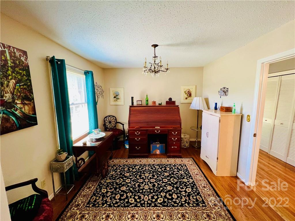 13701 Thompson Road Mint Hill, NC 28105 - Photo 10 of 25 a bed room with furniture and a window
