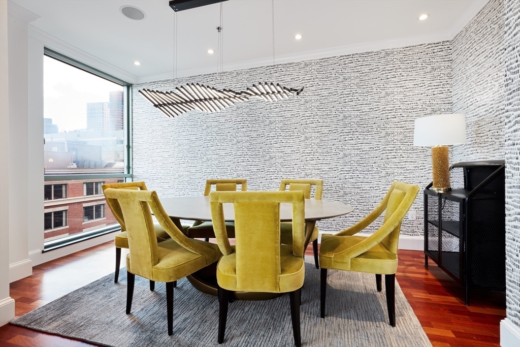 234 Causeway Street, Unit 913/813 Boston, MA 02114 - Photo 14 of 22 a view of a dining room with furniture and wooden floor
